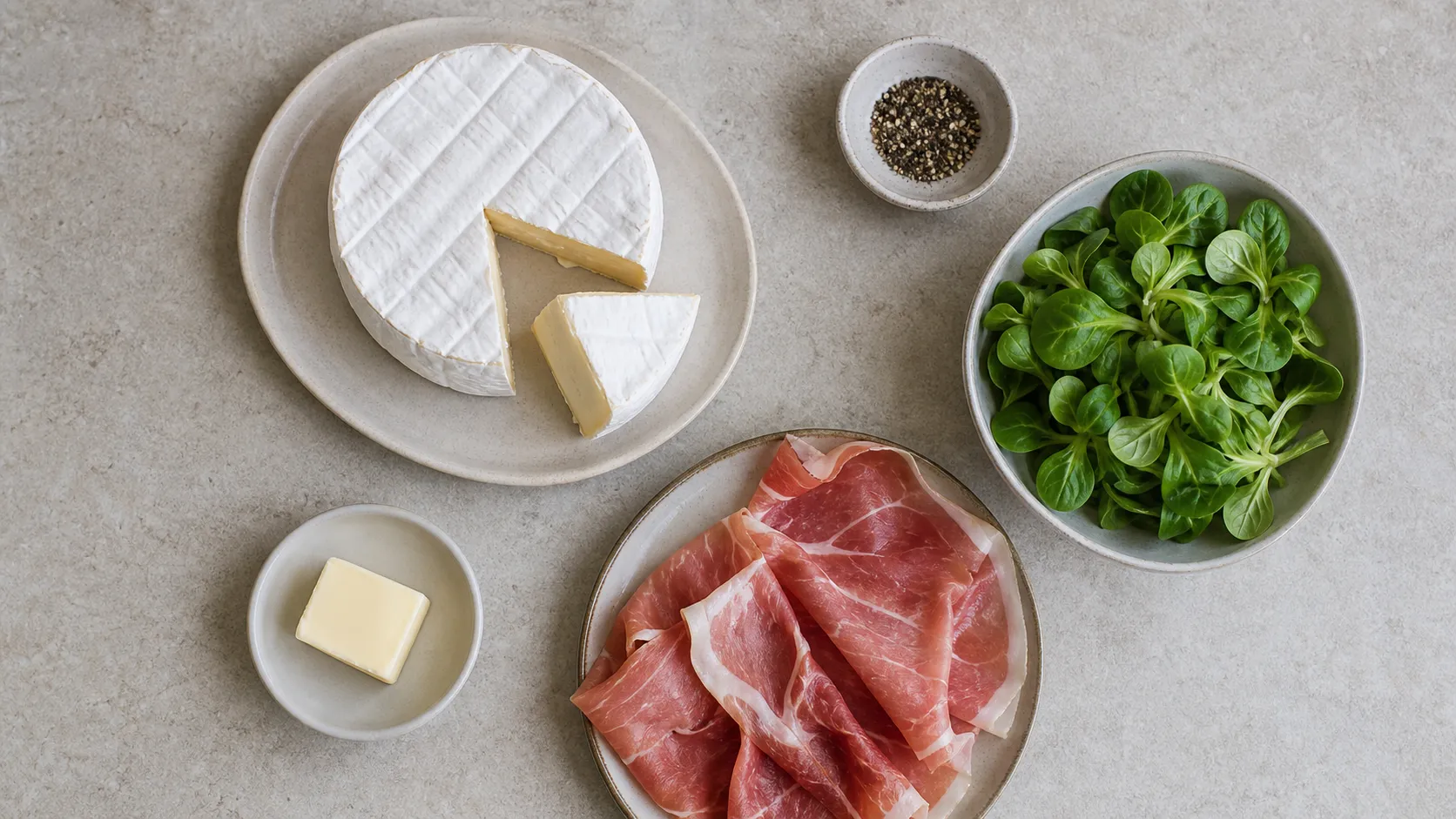 Ingredients: camembert, air-dried ham, butter, pepper, salad leaves