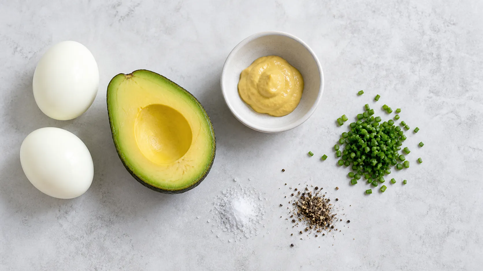 Ingredients for Keto Egg Avocado Salad - Quick 3-Minute Breakfast: 2 hard-boiled eggs, 80 g avocado (approx. ½ fruit), 1 tsp Dijon mustard, 1 tbsp chives (chopped), Salt, Pepper