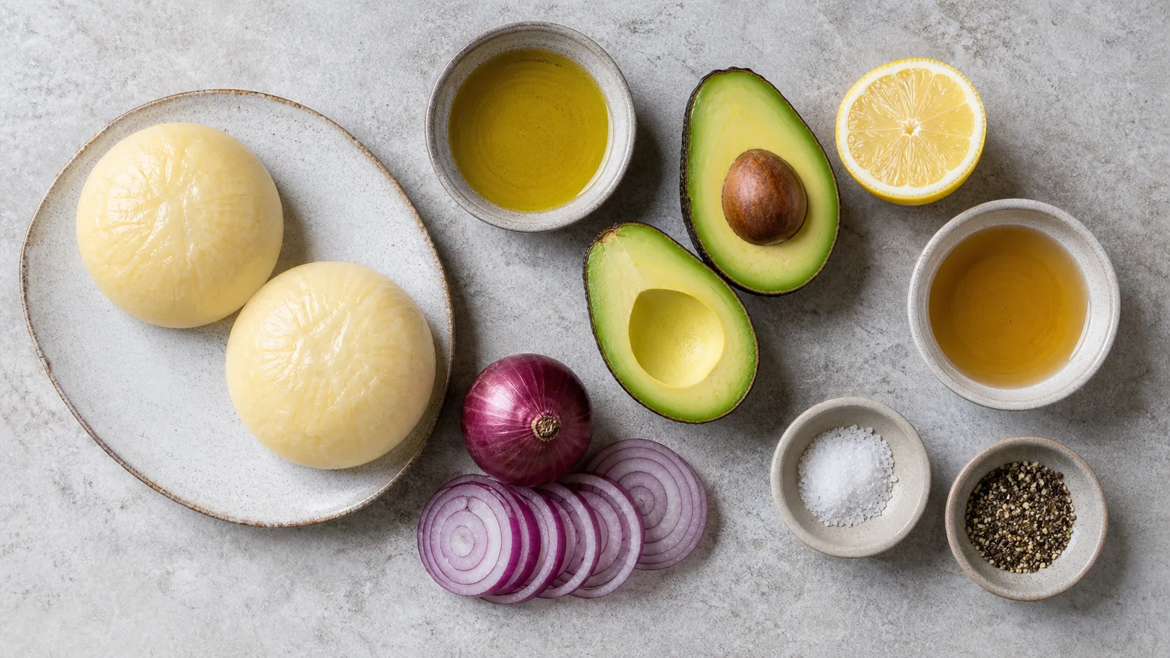 Ingredients for handkase with avocado: handkase, avocado, lemon, red onion, apple cider vinegar and olive oil