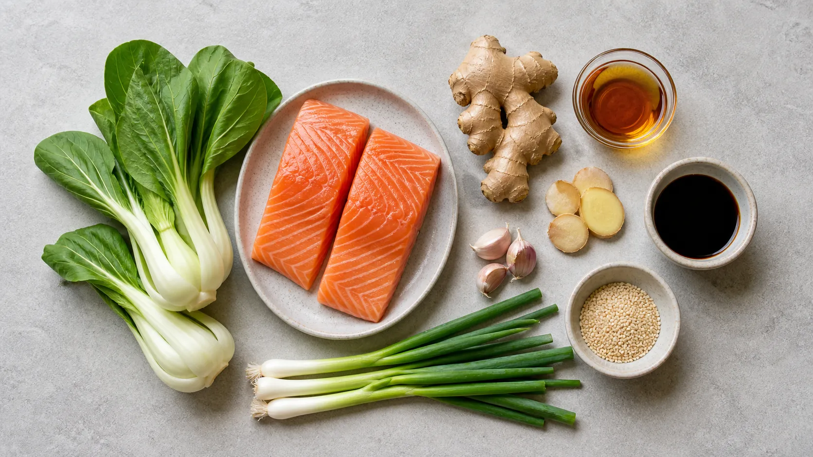 Ingredients for keto salmon with bok choy: salmon fillet, bok choy, ginger, garlic, sesame oil, tamari and sesame seeds