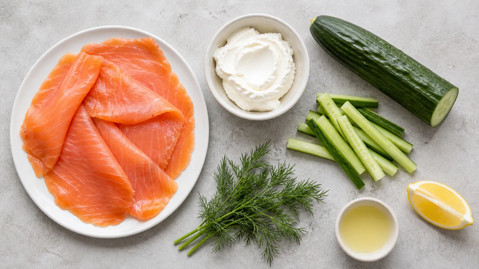 Ingredients for keto salmon rolls: smoked salmon, cream cheese, cucumber, dill