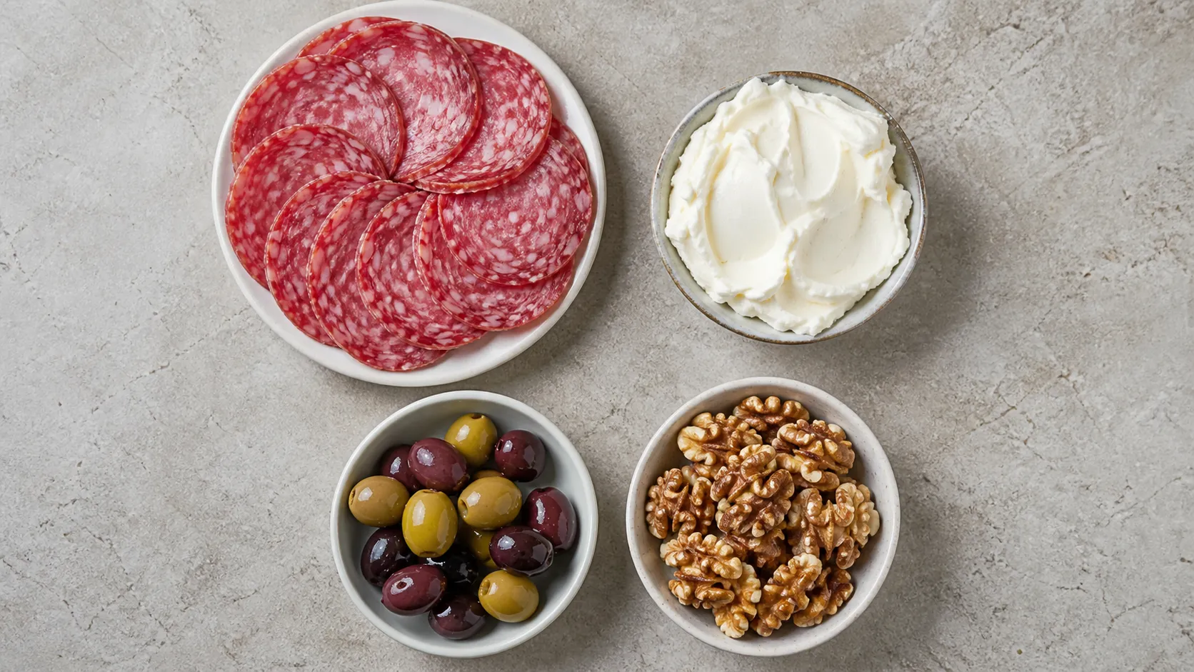Ingredients for Keto Salami, Cream Cheese and Olive Plate - Mediterranean Breakfast in 2 Minutes: 50 g salami (5-6 slices), 40 g plain cream cheese, 30 g olives (approx. 8 pieces), 15 g walnuts (approx. 4 halves)