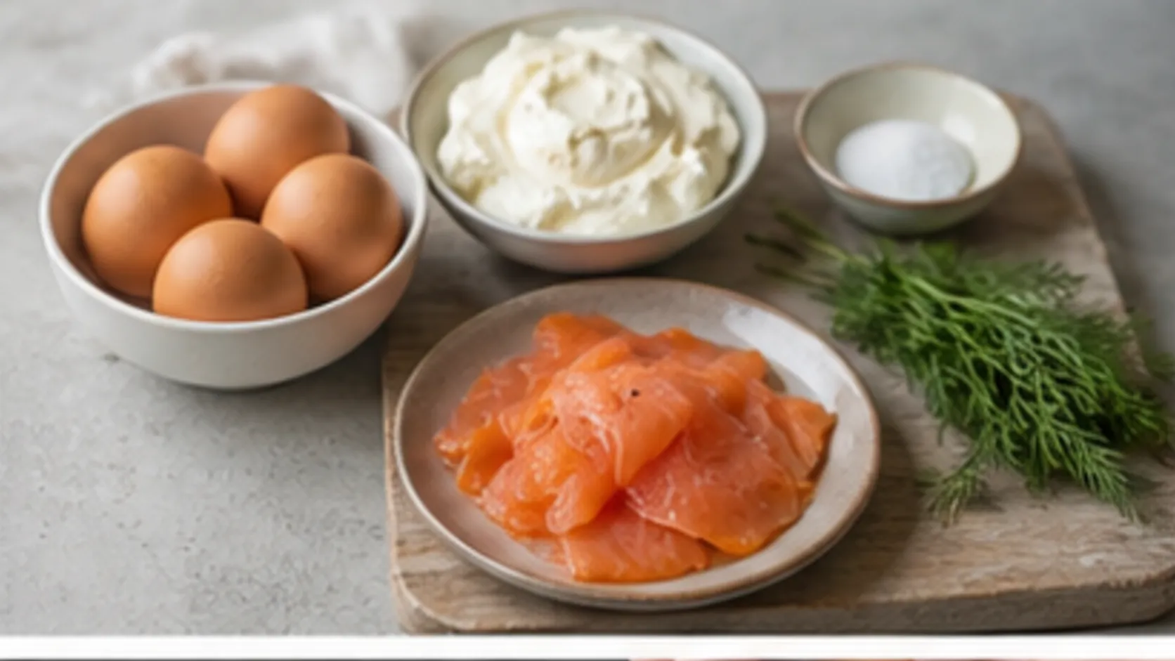 Ingredients for keto cloud bread with eggs, cream cheese, salt, smoked salmon and dill