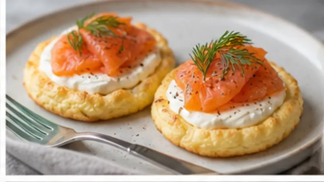 Keto cloud bread topped with cream cheese, smoked salmon and fresh dill on a plate